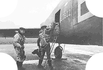 Iain Nicolson, DFC,DFM. loading his gear aboard before the Peenemunde Raid