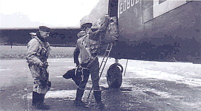 Ian Nicolson loads up his gear for the next mission on a Lancaster